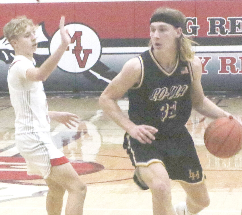 Logan-Magnolia's Wes Vana drives the ball past his defender in Western Iowa Conference play on Jan. 16 at Missouri Valley.