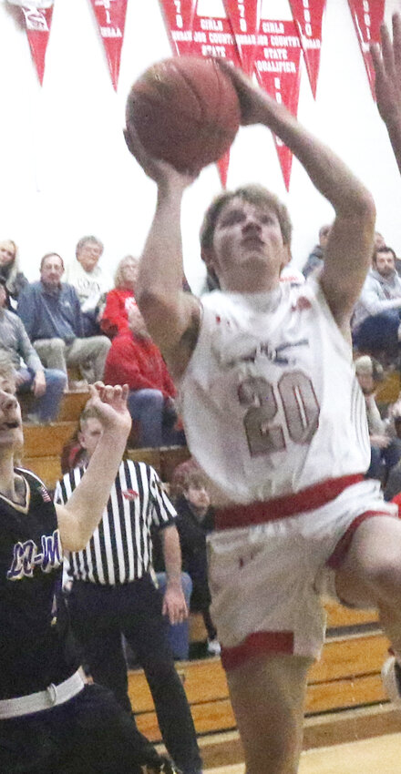 Missouri Valley's Mason Herman (20) puts back a shot in the Big Reds Western Iowa Conference win over Logan-Magnolia on Jan. 16.