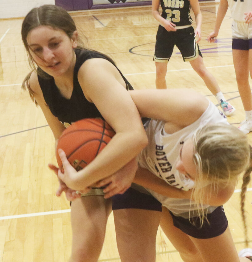 Woodbine's Taylor Hoefer battles for a rebound in Rolling Valley Conference play at Boyer Valley on Jan. 19 in Dunlap.
