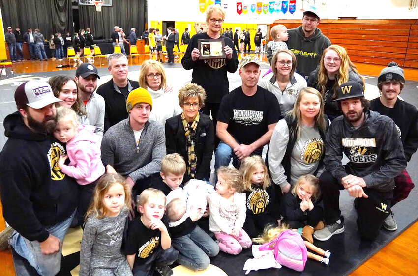 Members of the Meeker Family were honored at the final home wrestling dual on Jan. 25, as the school honored the late Ronnie Meeker.  The Tigers wrestling expert was a dedicated coach and official who has spent countless hours helping guide young wrestlers.  The Tiger legend was known as 'Mr. Tiger' for his tremendous support of the Tigers youth wrestling program.  The Tiger youth wrestling tournament in the first part of January is known at the Ron Meeker Invitational.  Ron's Wife,  Glenda, holds the plaque was given to the family at the final home dual, and will be in the wrestling room for the next generation of Tiger wrestlers to look up to.