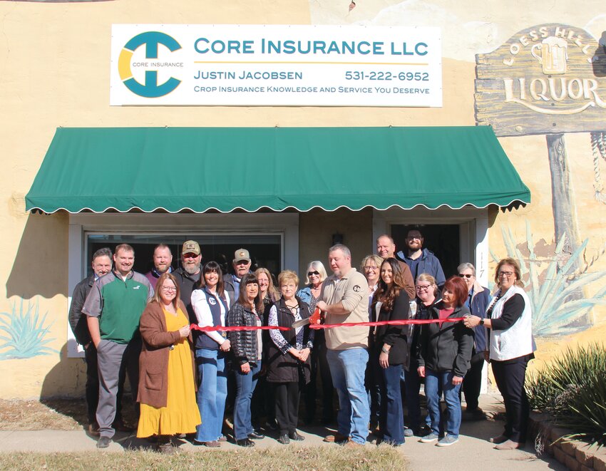 A ribbon cutting was held Feb. 20 for Core Insurance, located at 117 E Erie St. in Missouri Valley. Crop Insurance Agent Justin Jacobsen is pictured cutting the ribbon, with Missouri Valley Chamber of Commerce Director Jeannie Wortman to the left. Several other Chamber members and city officials attended the ribbon cutting.