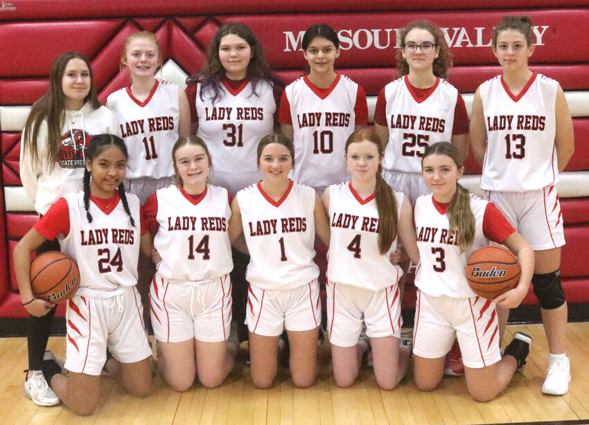 Members of the 2024 Missouri Valley Lady Reds eighth grade junior high basketball team include in the front row, from left: Rihna Ioanis, Peyton Livermore, Lily Handlos, Aiyanna Darr, LaVelle Miller.  Back row, Nevaeh O'Dowd (mgr.), Cymber Tierney, Ashlyn Bechen, Mayrany Loza Rodriguez, Brooklynn Allen, Ellie Arrick.  Not pictured: Paige Bell (mgr.).  They were led by Coaches Caley Barker and Nate Graham.