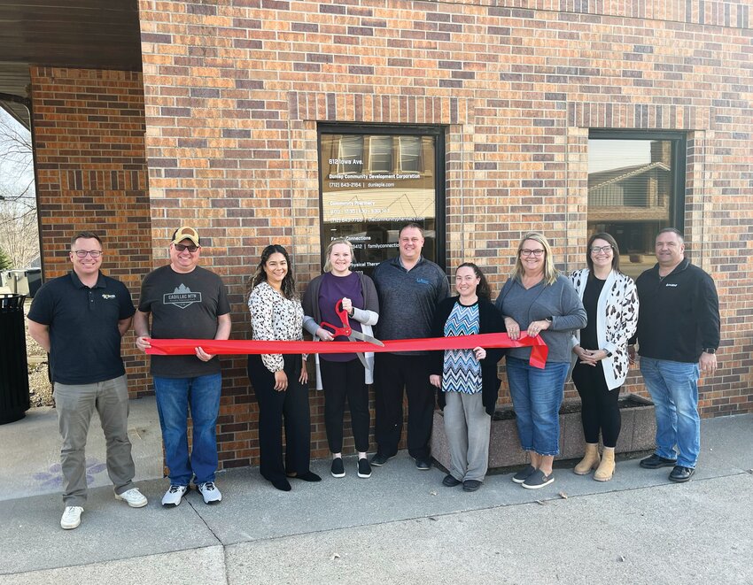 Pictured at the Lambert Family Chiropractic ribbon cutting from left to right: Austin McDonald, Roberto's Pizza and DCDC; Mike Bonsall, Bonsall TV &amp; Appliance and Dunlap City Council; Jennifer Carrillo, Office Administrator for Lambert Family Chiropractic; Dr. Madilyn Blunk; Dr. Derek Lambert; Valerie McCloskey, Community Pharmacy; Lisa Gross, The Town and Country Store and DCDC; Jill Schaben, DCDC; and Steve Puck, Van Wall Equipment and DCDC.