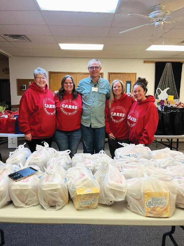 Five volunteers from MidAmerican Energy helped fill and hand out Easter baskets at the Harrison County Food Pantry.