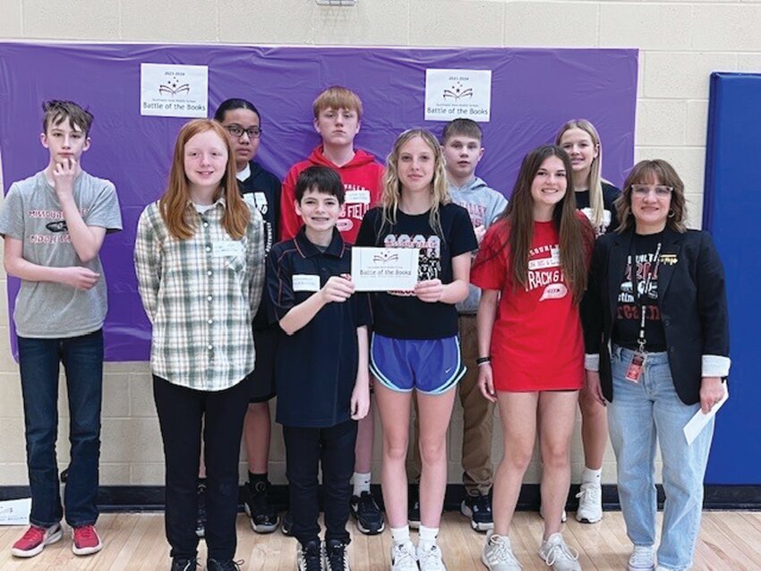 Team members for the seventh grade ELP Battle of the Books team, pictured in the front from left: Braxten Wonder, Alli Goodsell, Xander Lee, Madison Staben, Ellie Kohl and Carla Christensen (teacher/coach). Back row: Suliasi Tuamoheloa, Cade Tierney, Zyon Hornbacher and McKenna Maasen.