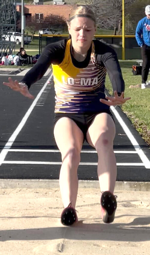 Logan-Magnolia's Abby Czarnecki lands in the long jump pit at the Ram Relays at Glenwood on April 11.