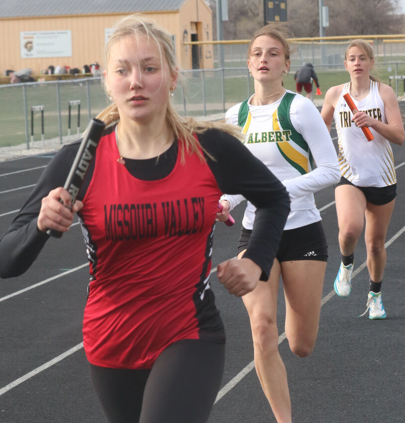 Missouri Valley's Madee Kierscht leads the pack during the distance medley relay at the Tri-Center Invitational on April 11.