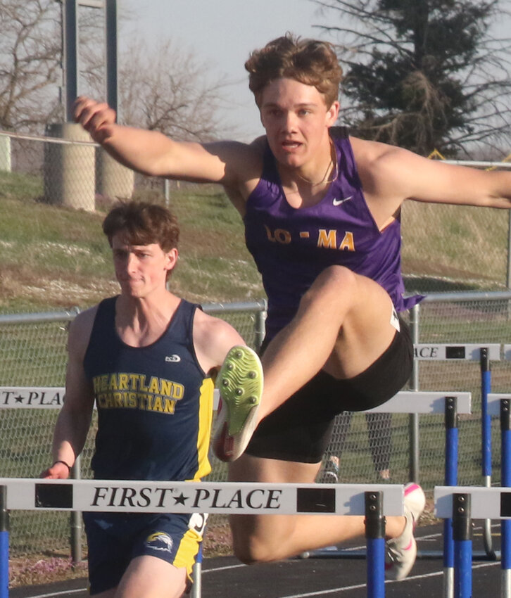 Logan-Magnolia's Carson Edney clears the hurdle at the Eagle Relays on April 12 at Underwood.