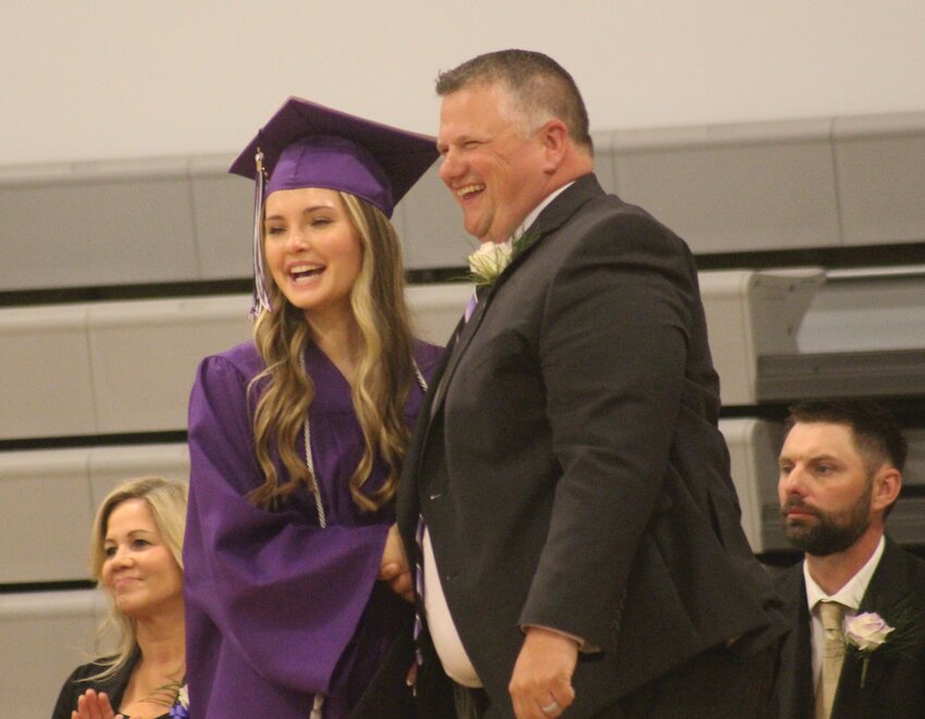 Anna Seuntjens and Supt. Jeremy Christiansen laugh at Boyer Valley commencement on Sunday.