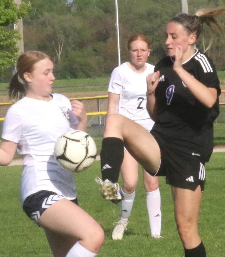 Logan-Magnolia's McKenna Witte (9) kicks the ball away from the defender in the Western Iowa Conference home finale on May 10 in Logan.