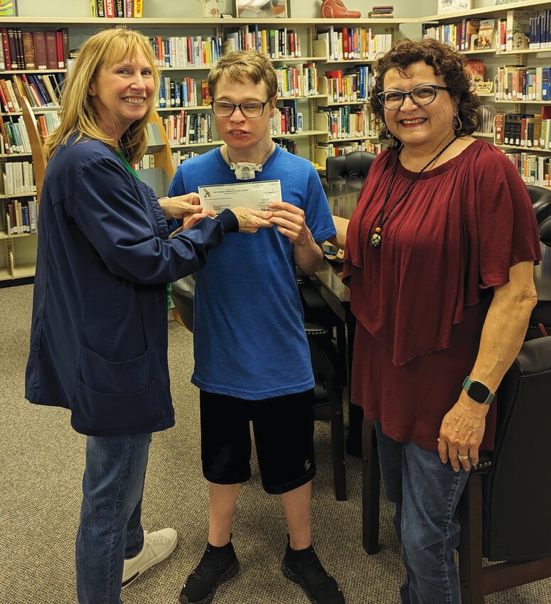 David Kuhns (middle) has been doing Kindness Project Coin Drives, and this year he decided to help the Mondamin Public Library. As a lover of books, he went and asked elementary kids if they would bring in coins and donate them to his project. On May 20, he was able to present a check of $611 to the library.