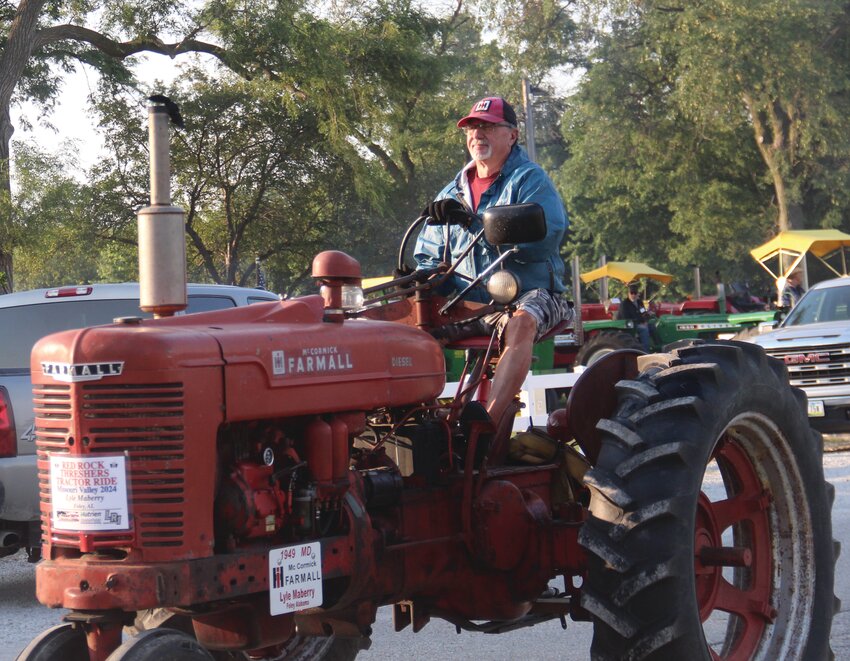The 22nd annual Red Rock Threshers tractor ride used the Harrison County Fairgrounds in Missouri Valley as home base this year. Pictured is Lyle Maberry, who came all the way up from Foley, Ala. for the event.