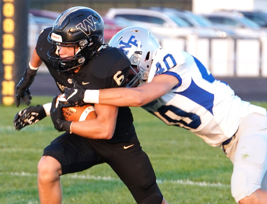 Woodibne's Joe Freund (6) breaks away from tne Newell-Fonda defender in 8-Man, District 1 acton on Sept. 13.  The Tigers will be at Siouxland Christian on Sept. 20.