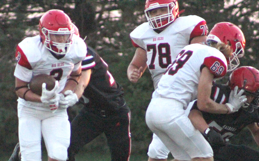 Missouri Valley's Rush Knudsen (3) follows the blocks of Corban Soetmelk (69) and Hudson Tompkins (78).