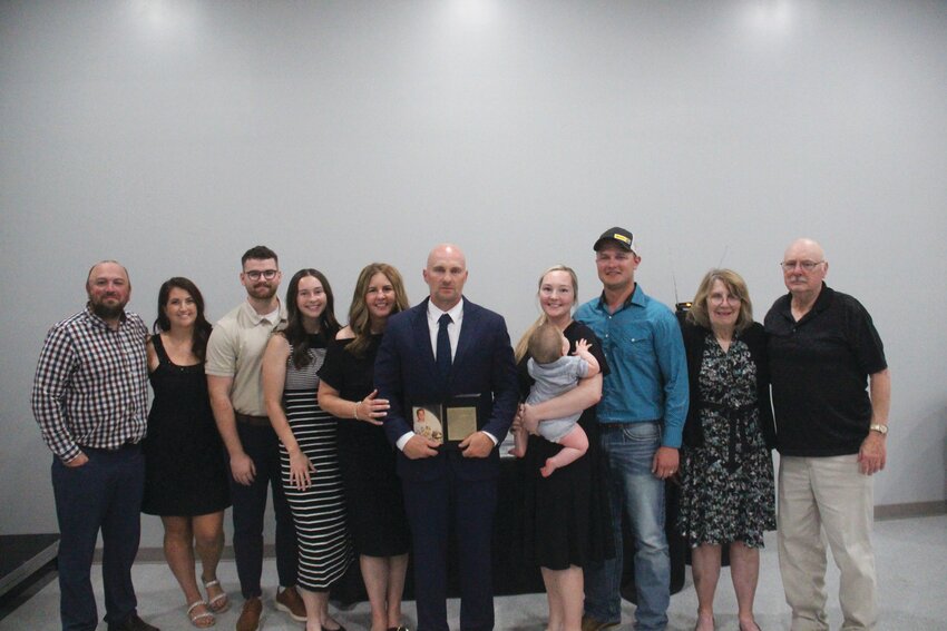 Matt Straight, middle, pictured with family, was inducted into the Logan-Magnolia Hall of Fame as a student athlete on Saturday at the Calvary Falls Event Center. He is currently head coach of the school's football program.