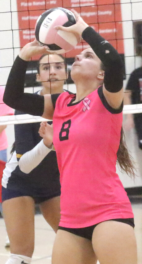 Missouri Valley's Nikayla Fichter (8) sets the ball to her teammates in Western Iowa Conference action.