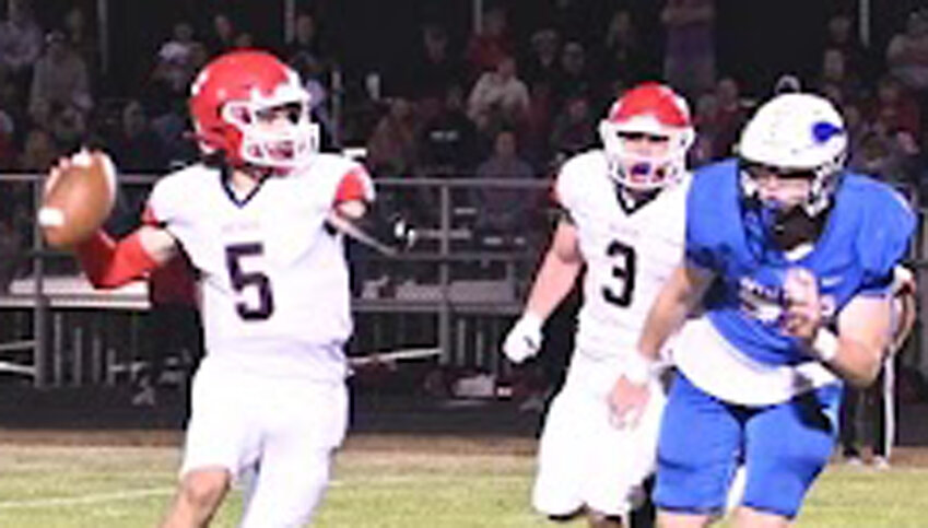 Missouri Valley's Brayden Nell (5) looks for a receiver down field in Class 1A, District 8 action on Oct. 4 at Avoca.