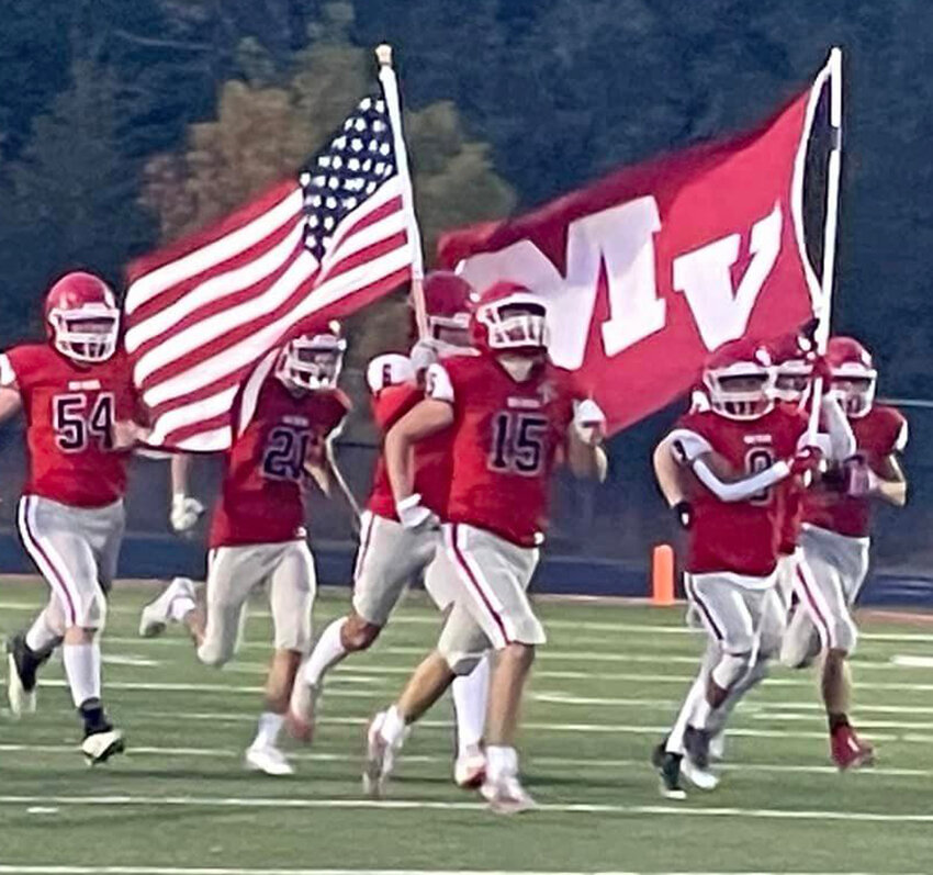 Missouri Valley's Maddox Wheeldon (15) and Diego Manzo (9) lead the Big Reds onto the field in their home game on Oct. 11.  The Big Reds will host Treynor for Senior Night this week (Oct. 18) as the regular season draws to a close.