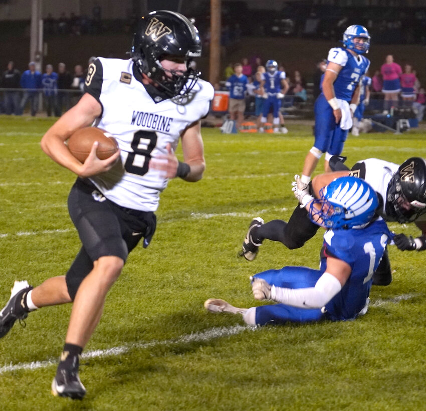 Woodbine's Brody Pryro follows his blocks in the 8-Man, District 1 battle at Remsen St. Marys on Oct. 11 in Remsen.  The Tigers will close out the regular season this week when they host East Mills for Senior Night.