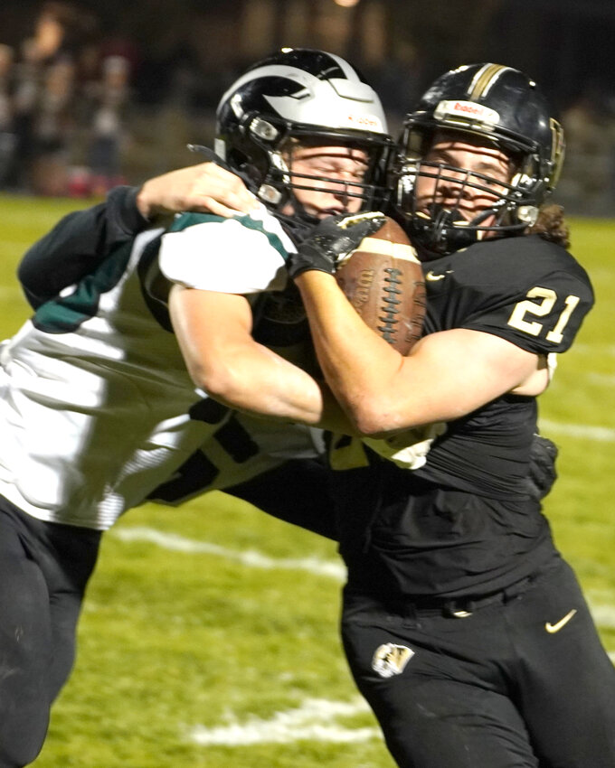 Woodbine's Brodie Ludwig powers the ball past his opponent in the regular season finale on Oct. 19 in Woodbine.  The Tigers will host their first home playoff game since 1997 this week when they host Collins Maxwell.
