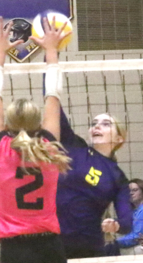 Logan-Magnolia's Brooklyn Lally slams the ball past the opponent in a match from earlier this season.  The Panthers opened up the Class 2A Regional Tournament on Oct. 21.