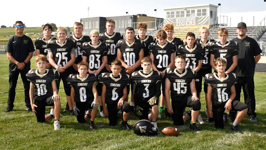 Members of the 2024 Woodbine Tigers junior high football team include in the front row, from left, Bradyen Wallis, Caleb Cox, Henry Placek, Evan Straka, Adam Andersen, Hunter Pronmnitz..  Middle row, Kam Kuhlmann, Luke Erickson, Brock Crook, Quinton Heistand, Kash Gares, Dawson Blum.  Back row, Coach Greg Kolpin, Carver Pryor, Reagan Blum, Derek Dickinson, Braden Barry, Jameson Bodeker, Easton Purcel, Coach Alec Schweizer.