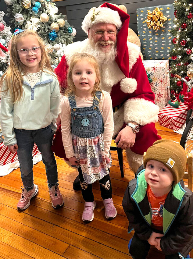 Bright Lights / Little City (Woodbine):  Tinsley, Tatym and Tyler Dickinson with Santa.