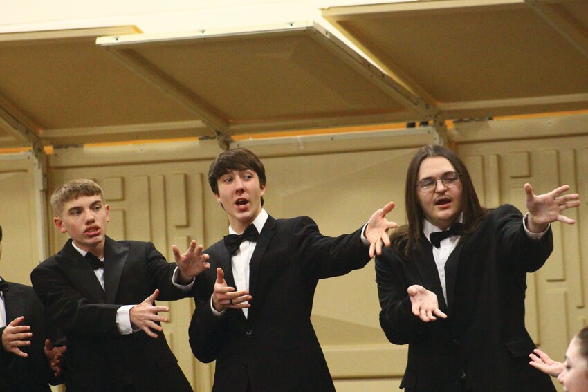 Dom McDowell, Theron Felner and Remington West sing &quot;The Twelve Days AFTER Christmas&quot; during the Missouri Valley holiday concert last week.