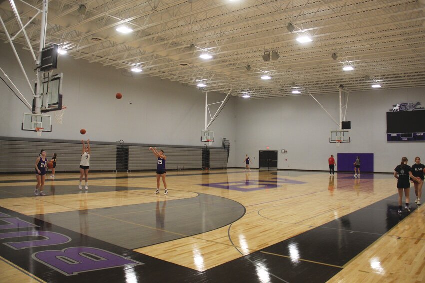 Members of the Boyer Valley Lady Bulldogs team shoot around on Monday, Dec. 23.This was the second shootaround in the new gym since water mitigation work was completed.