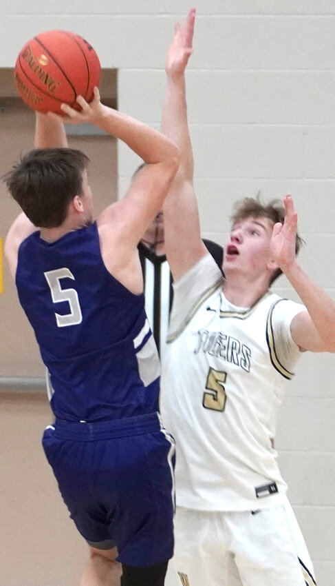 Woodbine's Landon Blum (5) pressurs the Boyer Valley shooter in Rolling Valley Conference play on Jan. 24 in Woodbine.