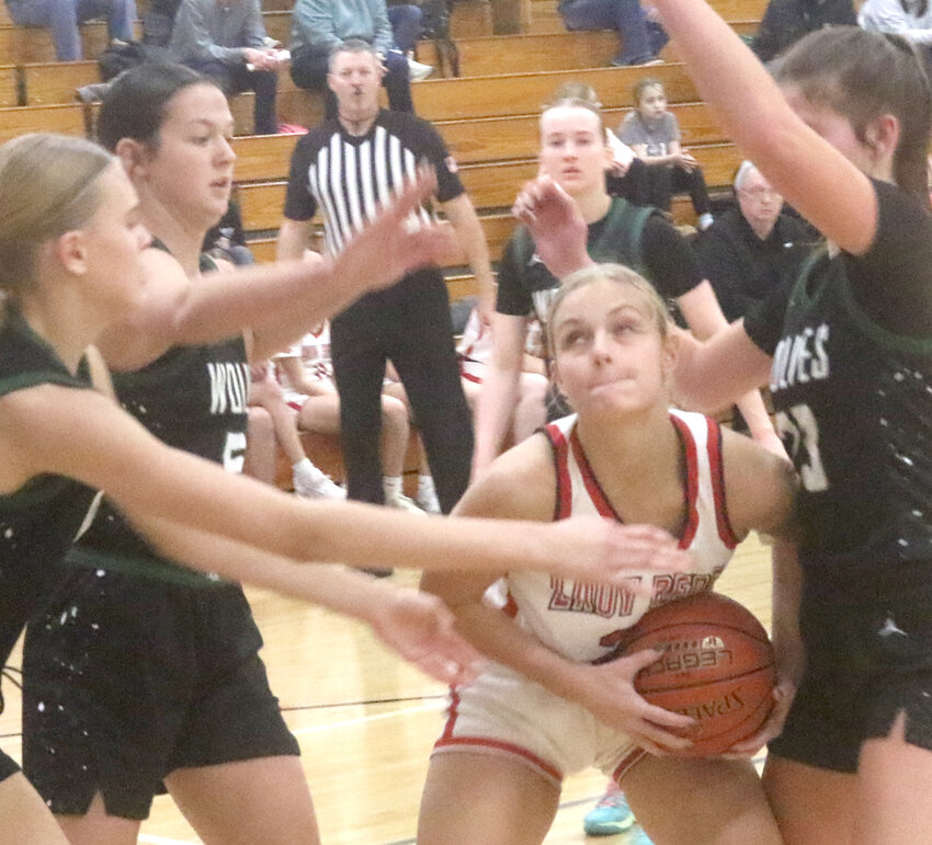Missouri Valley's Tylar Stirtz looks for room inside the lane during Western Iowa Conference play on Feb. 4 in Missouri Valley.  The Lady Reds will open up Class 3A Regional play on Feb. 15 at Carroll Kuemper.