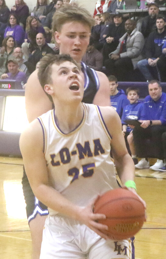 Logan-Magnolia's Jason Kastner (25) drives to the basket in the Western Iowa Conference finale on Feb. 11 at Logan.