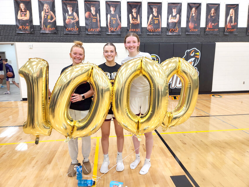Makylnee Yockey, Reagan Seuntjens and Trista Ohlmeier shared a special moment after all three seniors became members of the 1,000 career point club.