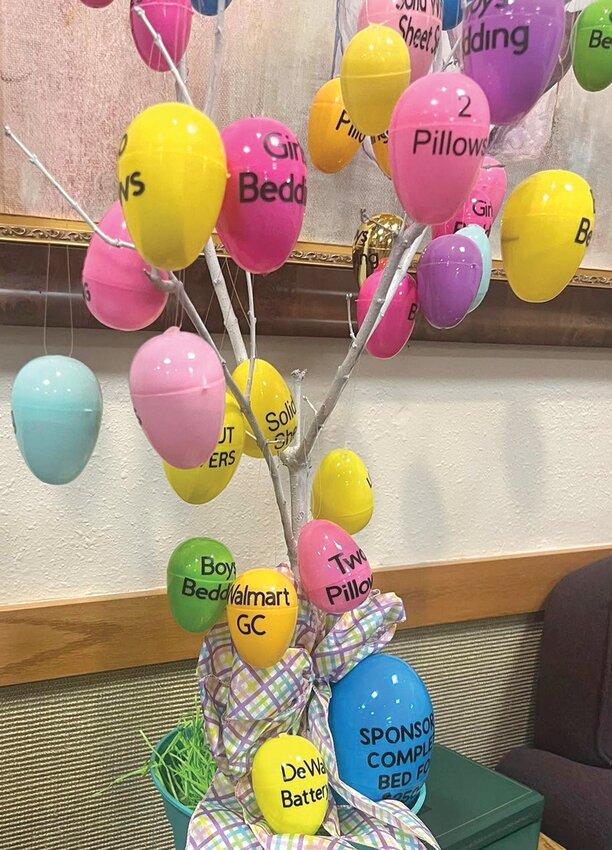 At the back of the St. John's UMC there is a tree filled with Easter Eggs with items needed by Sleep in Heavenly Peace.