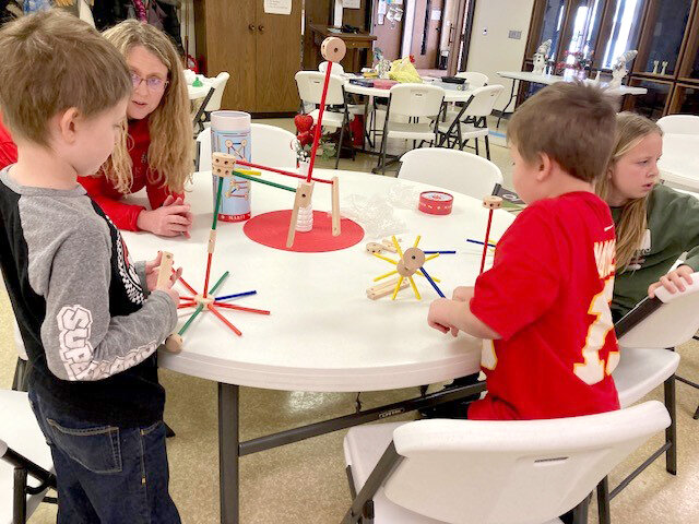 Leo and Sawyer working with a tinker toy.