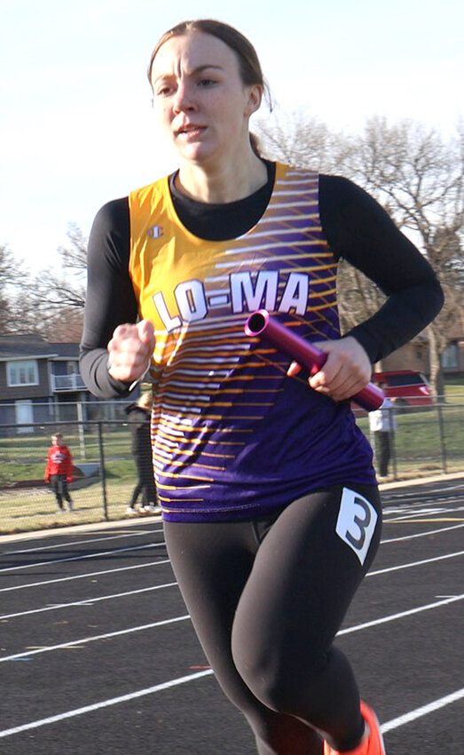 Logan-Magnolia's Allysen Johnsen sets the pace in the 3000 m run at the Wheeler Earlybird on March 31 in Audubon.