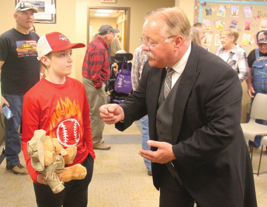 Teddy Roosevelt (a.k.a. Joe Wiegand) speaks with Micah Gutzmer after last week's event at the library.