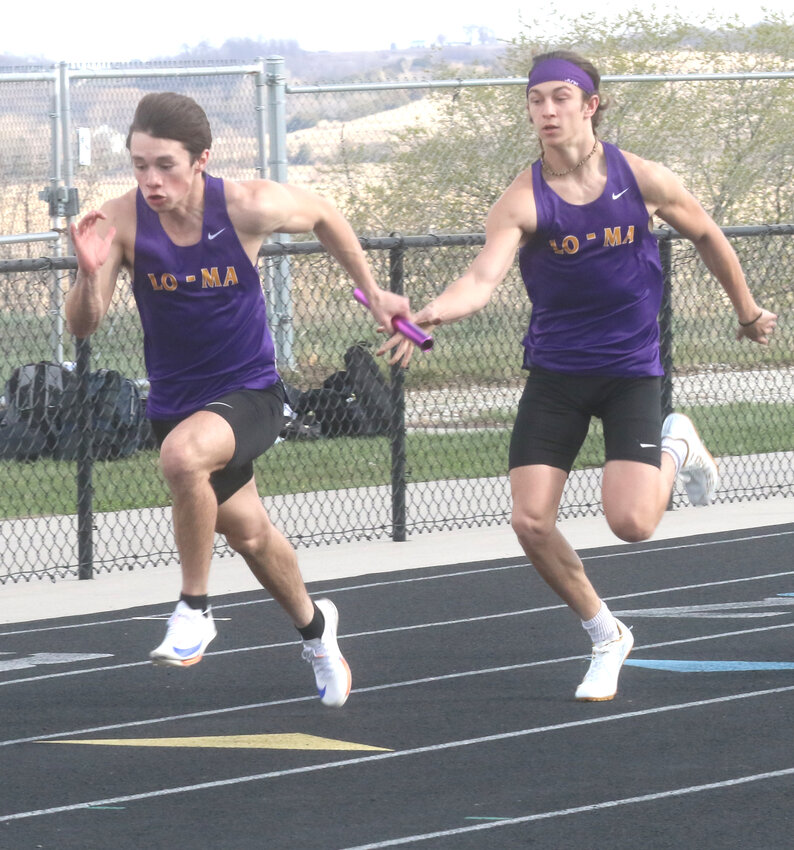 Logan-Magnolia's Drake Geith makes the pass to Will Anderson in the first exchange of the Sprint Medley Relay.  The Panthers picked up a first place finish and set a new school record at the Big Reds Relays on April 10 in Missouri Valley.