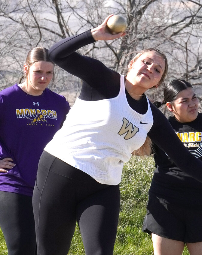 Woodbine's Emma Crook launches the shot put at the Monarch Relays on April 11 in Denison.
