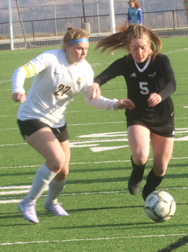 Missouri Valley's Emerson Anderson (5) chases down the ball during the Lady Reds home victory over Atlantic on April 8 in Missouri Valley.