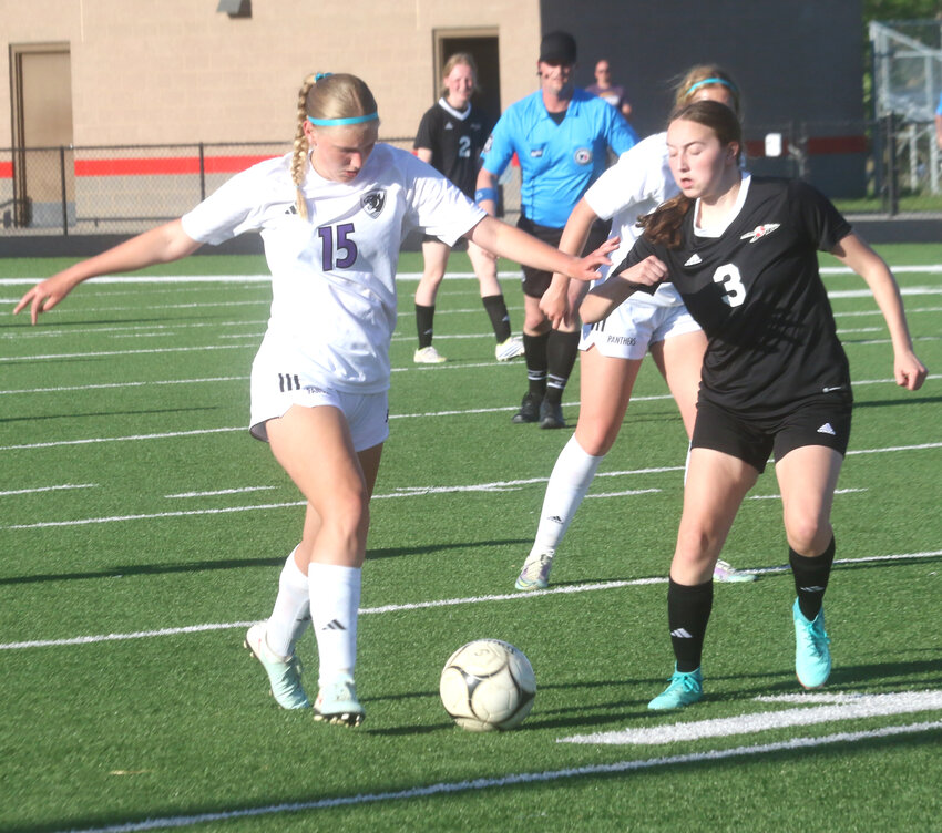 Logan-Magnolia's Marissa Fogelman (15) and Missouri Valley's Sophie Kirk (3) battle for possession in regular season play on May 5 at Missouri Valley.