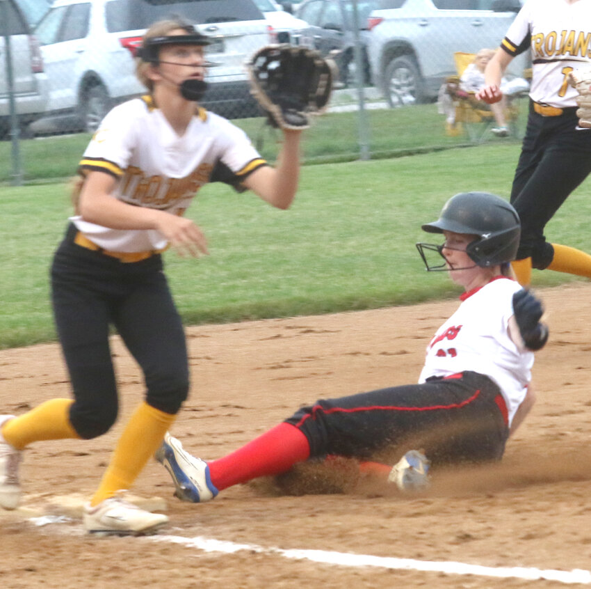 Missouri Valley's Rylee Evans slides in safely ahead of the tag in Western Iowa Conference play on June 5 in Missouri Valley.