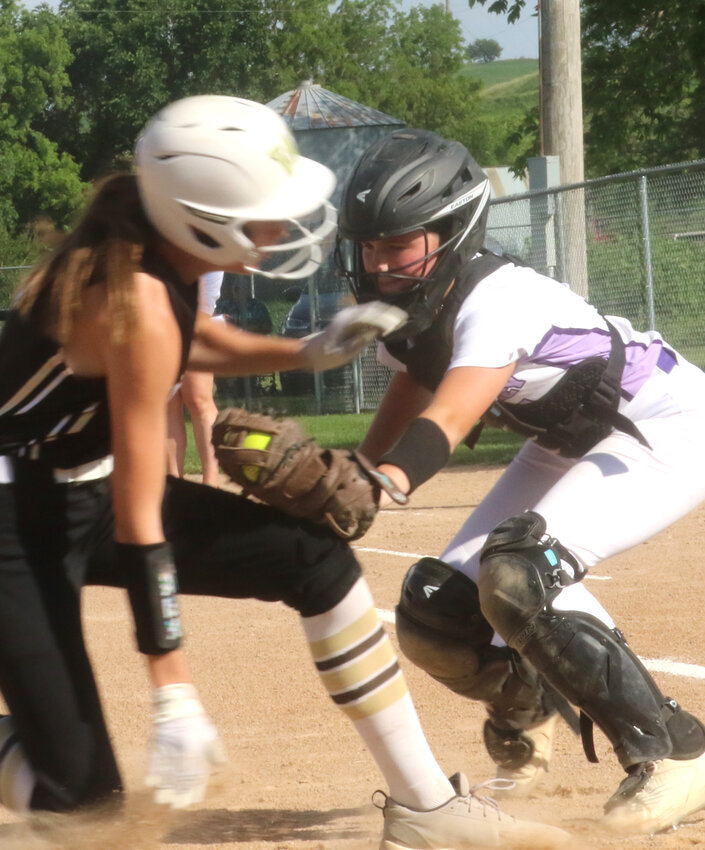 Boyer Valley's Maggie Yanak tags out the Woodbine baserunner in Rolling Valley Conference action on June 11 in Dow City.