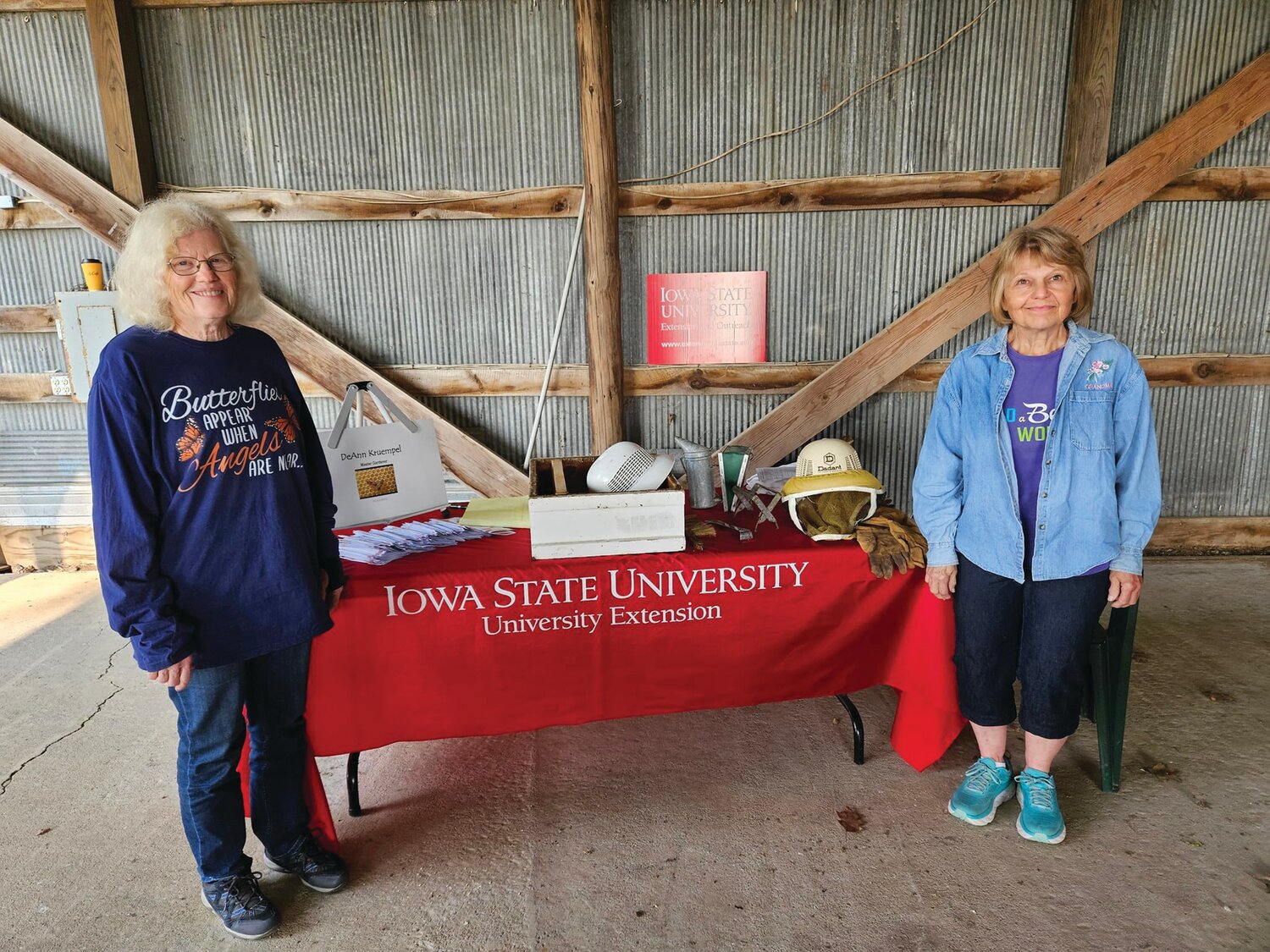 Sherri Webb, left, and DeAnn Kruempel, right, are pictured at Carsten's Farm Days in Shelby, Iowa. Webb takes her butterflies, Kruempel takes her bees and the pair visit with students at the event.