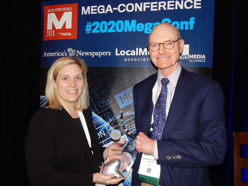 The winner of the 2020 Mega-Innovation Award was the Arkansas Democrat-Gazette for its iPad strategy. Pictured with the award is Eliza Gaines, VP of audience development at WEHCO Media Inc. (left), and publisher Walter E. Hussman Jr. (Photo by Nu Yang/Editor & Publisher magazine)