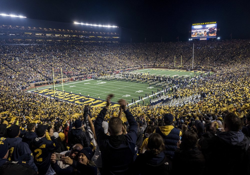 Fans cheer as the Michigan football team takes the field at Michigan Stadium for an NCAA college football game against Wisconsin in Ann Arbor, Michigan, Oct. 13, 2018. (Tony Ding / AP)