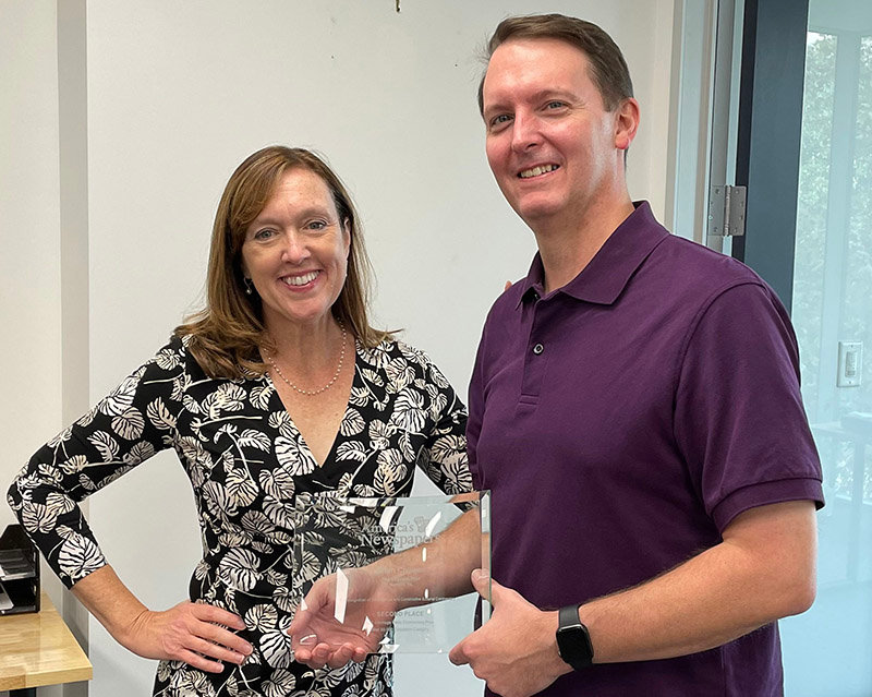 Kris Worrell, editor-in-chief of The Virginian-Pilot, presented the second-place Carmage Walls Commentary Prize in the over 50,000 circulation category to Brian Colligan, opinion editor of The Virginian-Pilot.