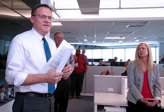 Greg Borowski speaks to the newsroom after the announcement of his appointment as executive editor of the Milwaukee Journal Sentinel.  Immediately behind him is George Stanley, his predecessor; seated at the right is Amalie Nash, senior vice president, local news and audience development at USA TODAY Network. (Angela Peterson / Milwaukee Journal Sentinel)