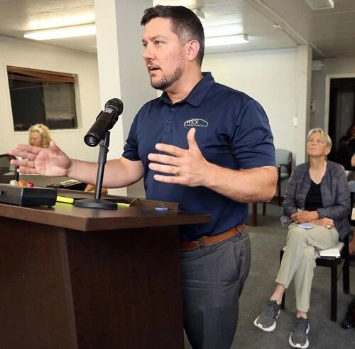 Francis Wick, CEO of Wick Communications, speaks at Wednesday’s Bisbee City Council meeting where a five-year agreement on permits for the Bisbee 1000 was approved. (Mark Levy / Herald/Review)