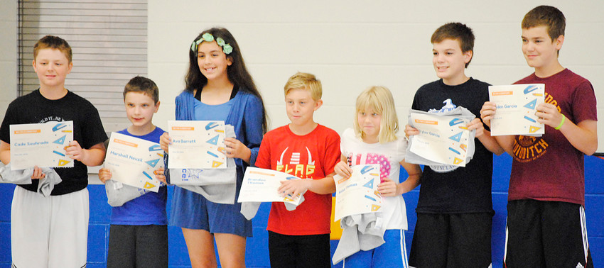 Wilton Elementary School presented students with perfect school attendance this year a certificate and T-shirt during the last day of school assembly on May 23. Pictured from left are Cade Souhrada, Marshall Neuzil, Ava Barrett, Brandon Thomas, Kelsie Thomas, Tyler Garcia and Kaiden Garcia, all of whom never missed a day of school.